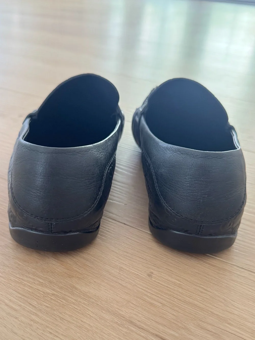 Gucci Black GG Embossed Leather Penny Loafers